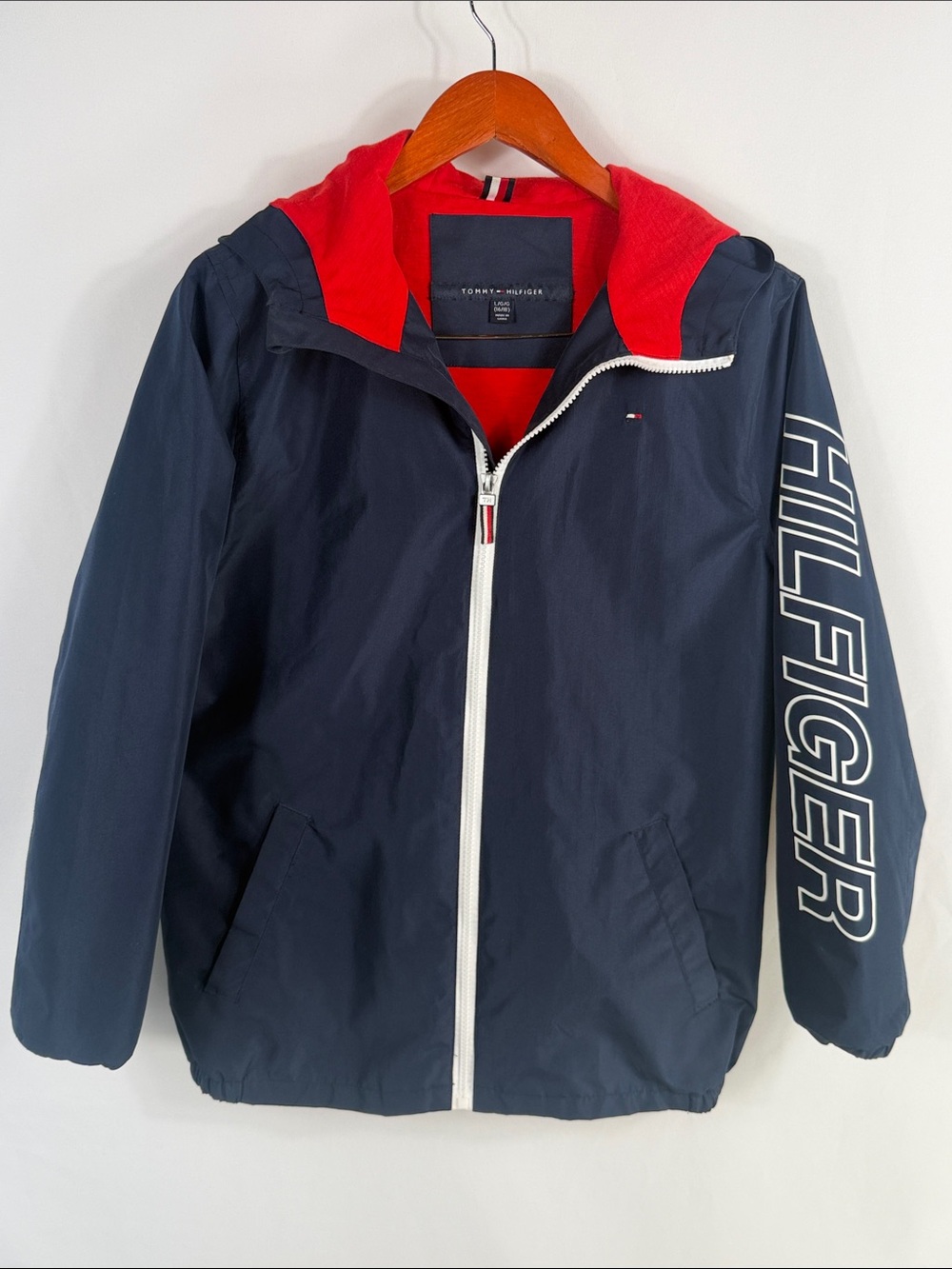 Tommy Hilfiger Navy Jacket with Red Hood and White Zip. Youth Large 16/18.
